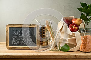 Zero waste  lifestyle concept with cotton bag and glass jars on wooden table photo