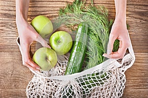 Zero waste, plastic-free and eco-friendly lifestyle and shopping. Cotton mesh bag with vegetables and fruits