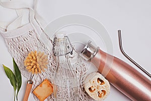 Zero waste plastic free home tools and items on white background.