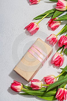 Zero waste spring gift concept. Pink tulips, surprise box for Anniversary, Mothers or Valentines Day