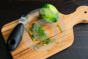 Zesting a Lime on a Wood Cutting Board