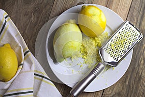 Zesting organic lemon fruits