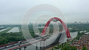 Zhivopisniy bridge aerial drone zoom out from above around green trees