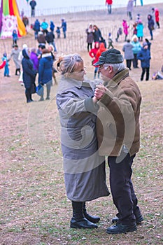 Zhytomyr, Ukraine - October 03, 2015: old couple dancing in the park beach