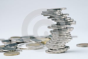 Zigzag unstable stack of coins, uncertainty of business, risk of photo