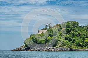 Villa on cliff between bay and ocean, Zihuatanejo, Mexico photo