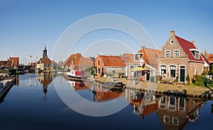 Zijlroede canal with houses and Sylhus, lock house, in old town of Hindeloopen, Friesland, Netherlands photo