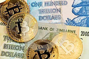 Zimbabwe hyperinflation banknotes and  Bitcoin Cryptocurrency coins