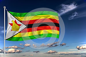 Zimbabwe national flag waving in the wind against deep blue sky.  International relations concept