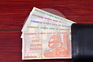 Zimbabwean dollars in the black wallet