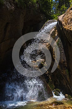 Zimitzbach waterfall flowing on stone. Austria Alps mountain area