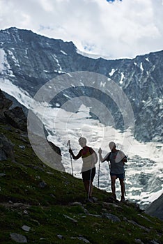 Senior couple hiking in mountains.