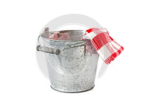Zinc bucket with red checkered tea towe