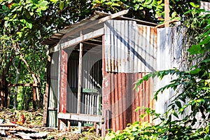Zinc cabin rusty in wasteful area with sunshine