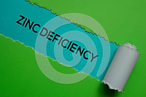 Zinc Deficiency Text written in torn paper. Medical concept