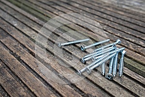 Zinc plated screws on top of old reclaimed