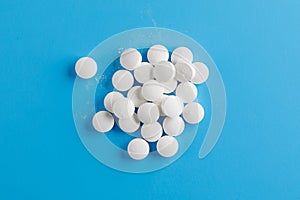 Zinc tables, nutrition supplement pills on blue background