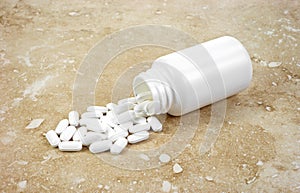 Zinc tablets spilling from bottle