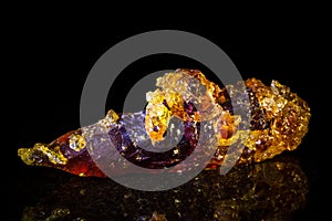 Zincite mineral stone in front of black