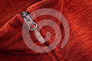 Zip zipper close up macro on red clothes background