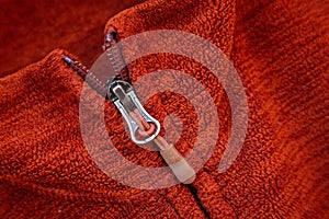 Zip zipper close up macro on red clothes background