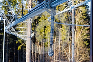 Zipline adventure cableway in the forest between trees