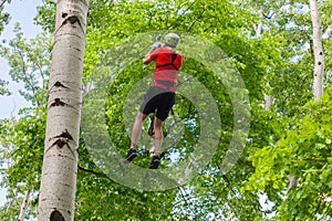 On zipline in adventure park