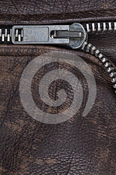 Zipper of a brown leather jacket
