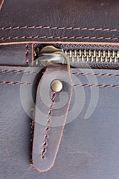 Zipper on leather bag close up