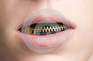 Zipper in Mouth of Youthful Person