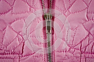 Zipper on pink balon jacket close-up shot photo