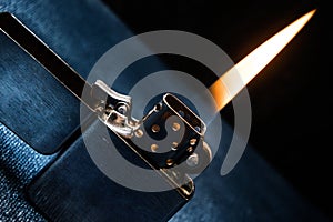 Zippo lighter closeup with flame