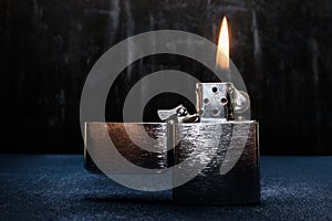 Zippo lighter closeup with flame