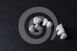 Zircon dentures on a black background - Ceramic veneers - lumineers