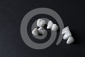 Zircon dentures on a black background - Ceramic veneers - lumineers photo