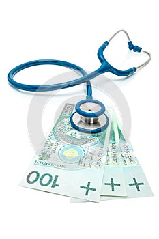 Zloty - Polish currency with stethoscope over it - isolated on white