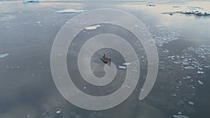 Zodiac boat sail brash ice tracking aerial view