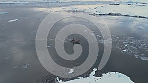 Zodiac boat sail brash ice tracking aerial view photo