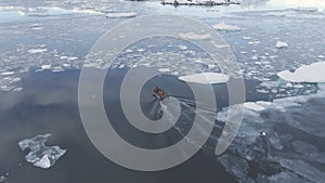 Zodiac boat sail brash ice water back aerial view