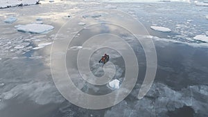 Zodiac boat sail brash ice water back aerial view