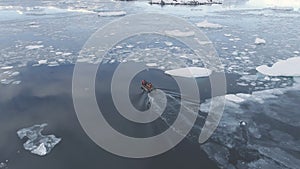 Zodiac boat sail brash ice water back aerial view photo