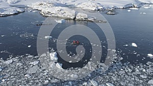 Zodiac boat sail brash ice water tracking pan photo
