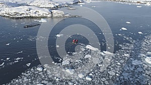 Zodiac boat sail brash ice water tracking pan photo