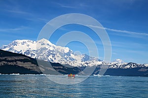 Zodiac Cruising in Icy Bay with Mount Saint Elias in the background, Alaska