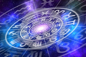 Zodiac signs inside of horoscope circle on universe background