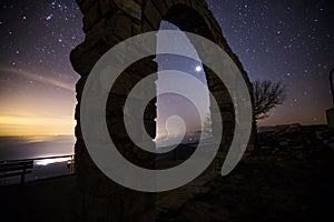 Zodiacal light and night sky in Santuari De La Mare De Deu Del Mont, La Garrotxa, Spain