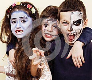 Zombie apocalypse kids concept. Birthday party celebration facepaint on children dead bride, scar face, skeleton