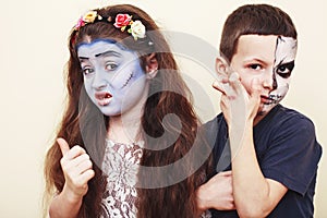 Zombie apocalypse kids concept. Birthday party celebration facepaint on children dead bride, scar face, zombie skeleton