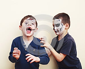 Zombie apocalypse kids concept. Birthday party celebration facepaint on children dead bride, scar face, zombie skeleton
