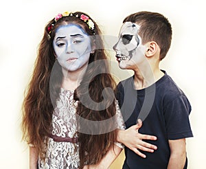 Zombie apocalypse kids concept. Birthday party celebration facepaint on children dead bride, and skeleton boy and girl